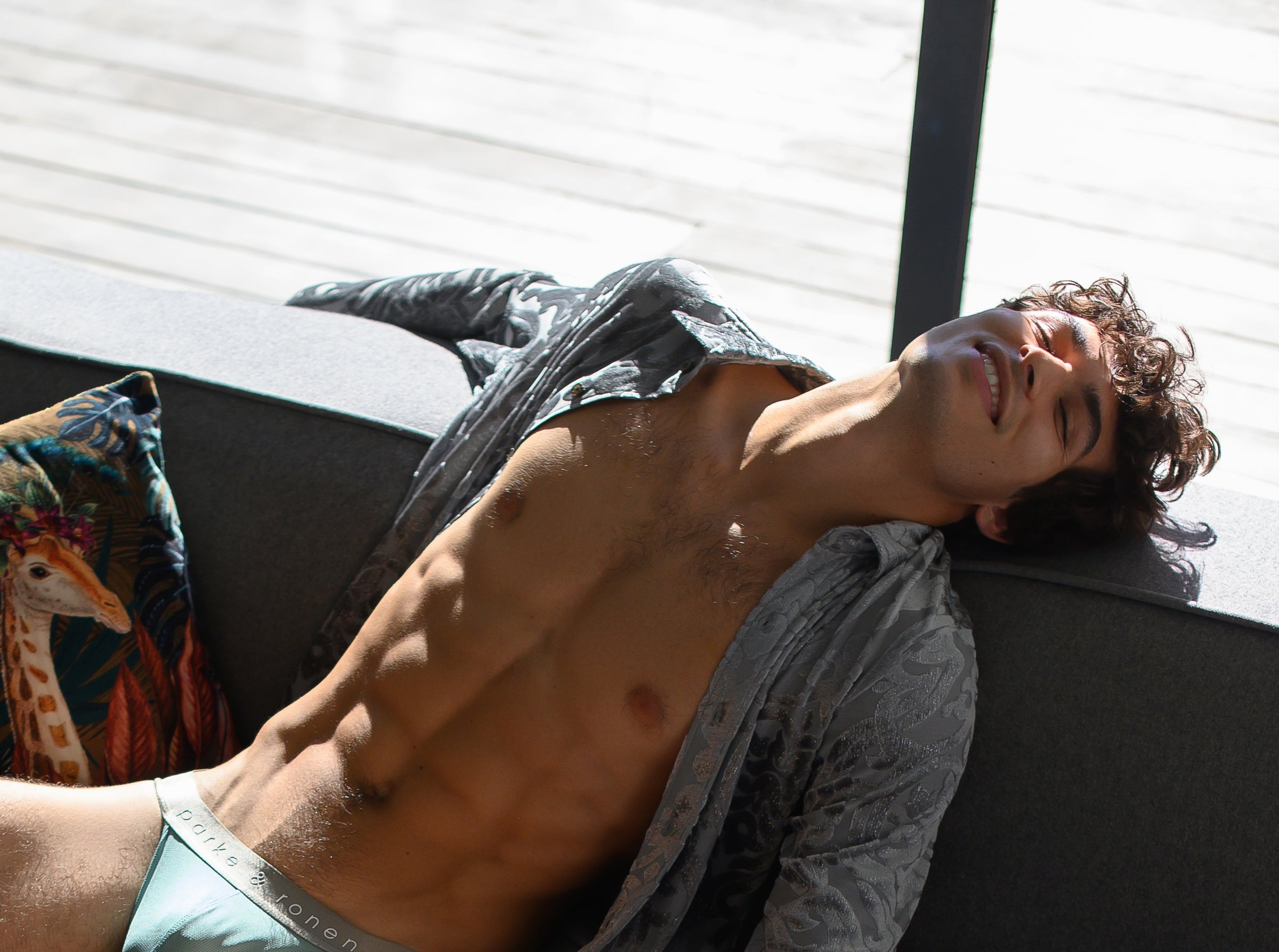 Parke & Ronen Holiday 2024.  Male model wears Holiday edition shiny velvet shirt for your holiday party outfit.