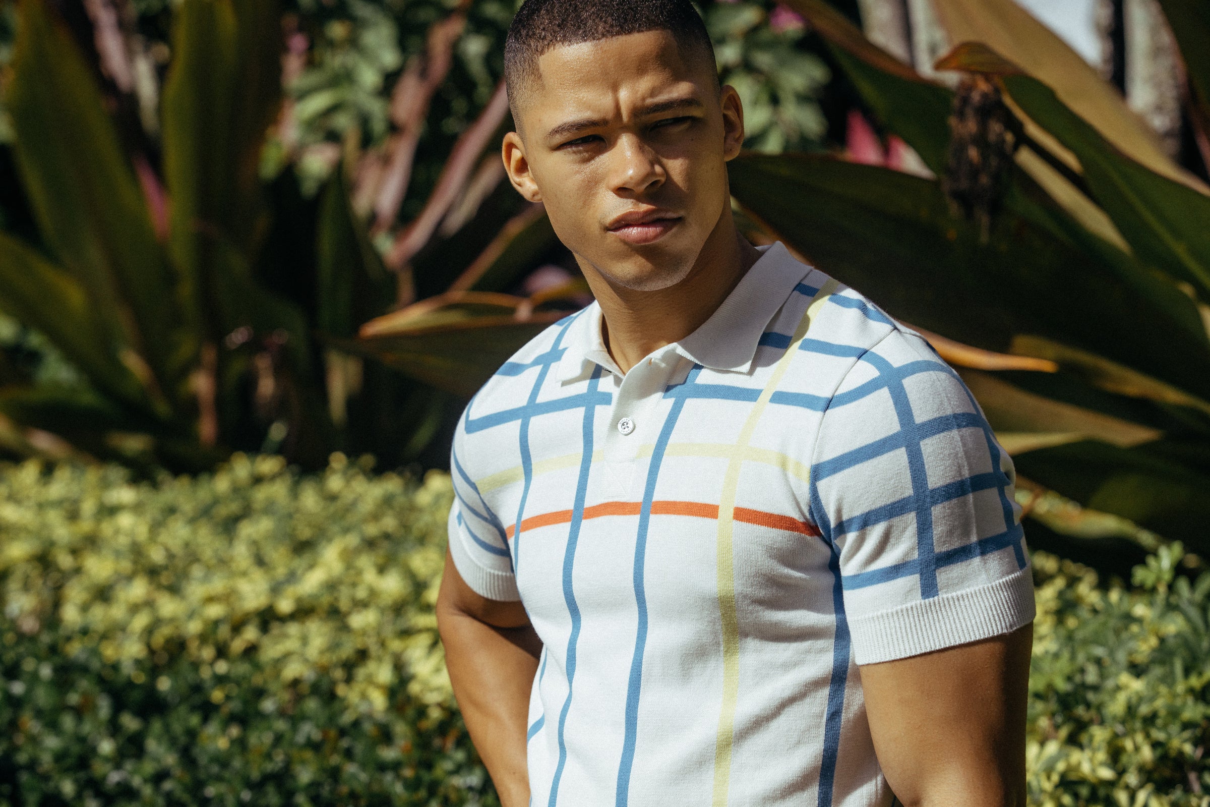 Parke & Ronen Spring 2021 campaign image on male model wearing the Becker Polo in white.