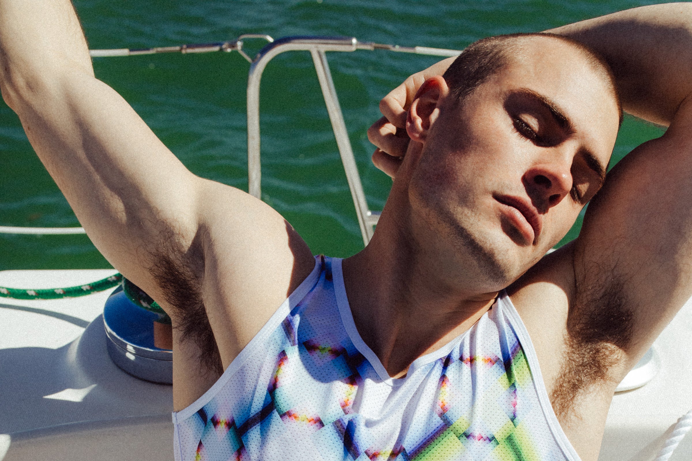 Parke & Ronen campaign image. Male model wear Sour Patch prints mesh tank top.
