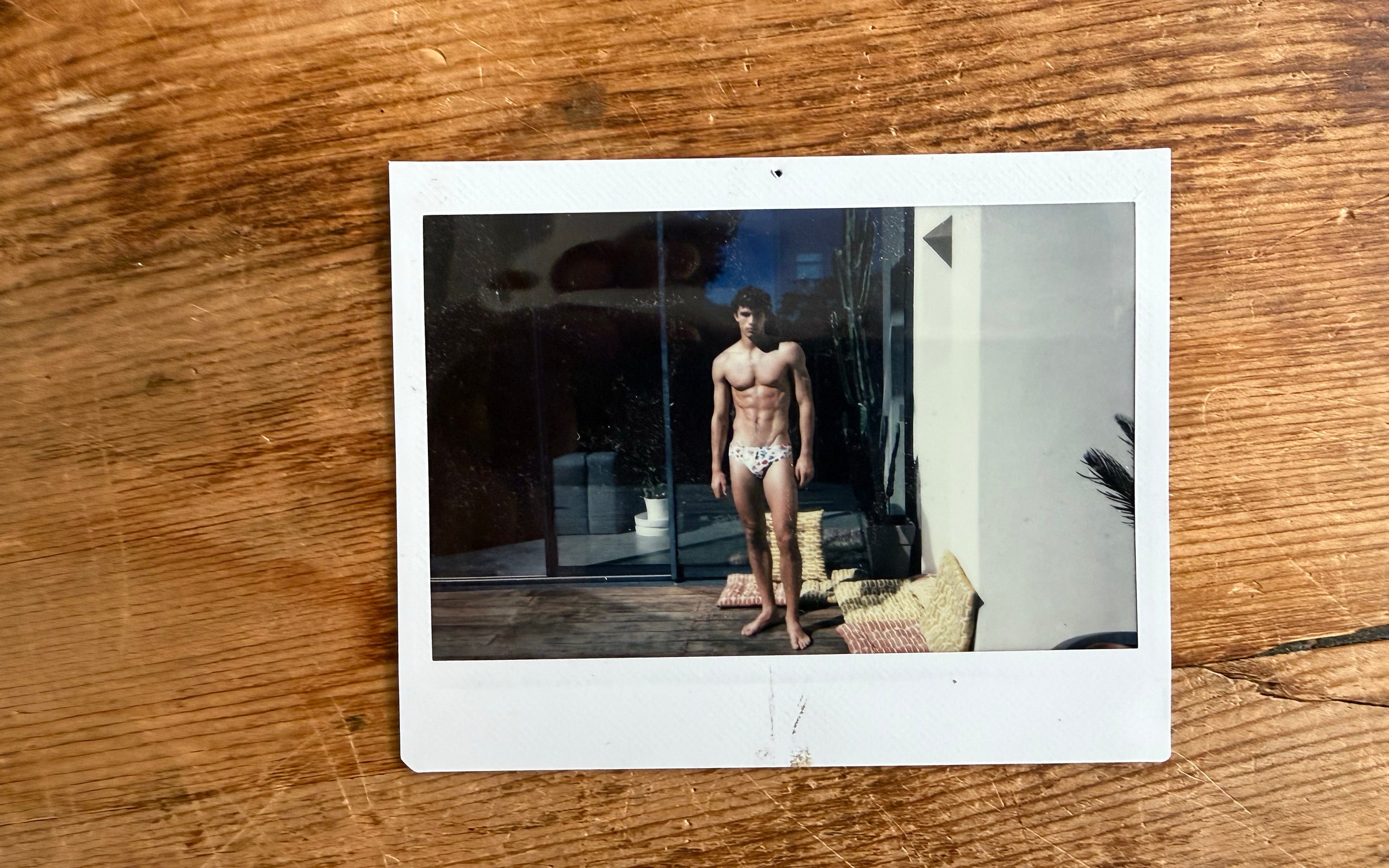 Polaroid image of man in Parke & Ronen swim brief.