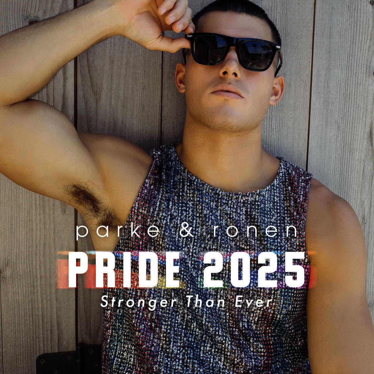 Parke & Ronen Pride 2025 Capsule collection.  Male Model Wears the Sequin Cropped Muscle tee in black.