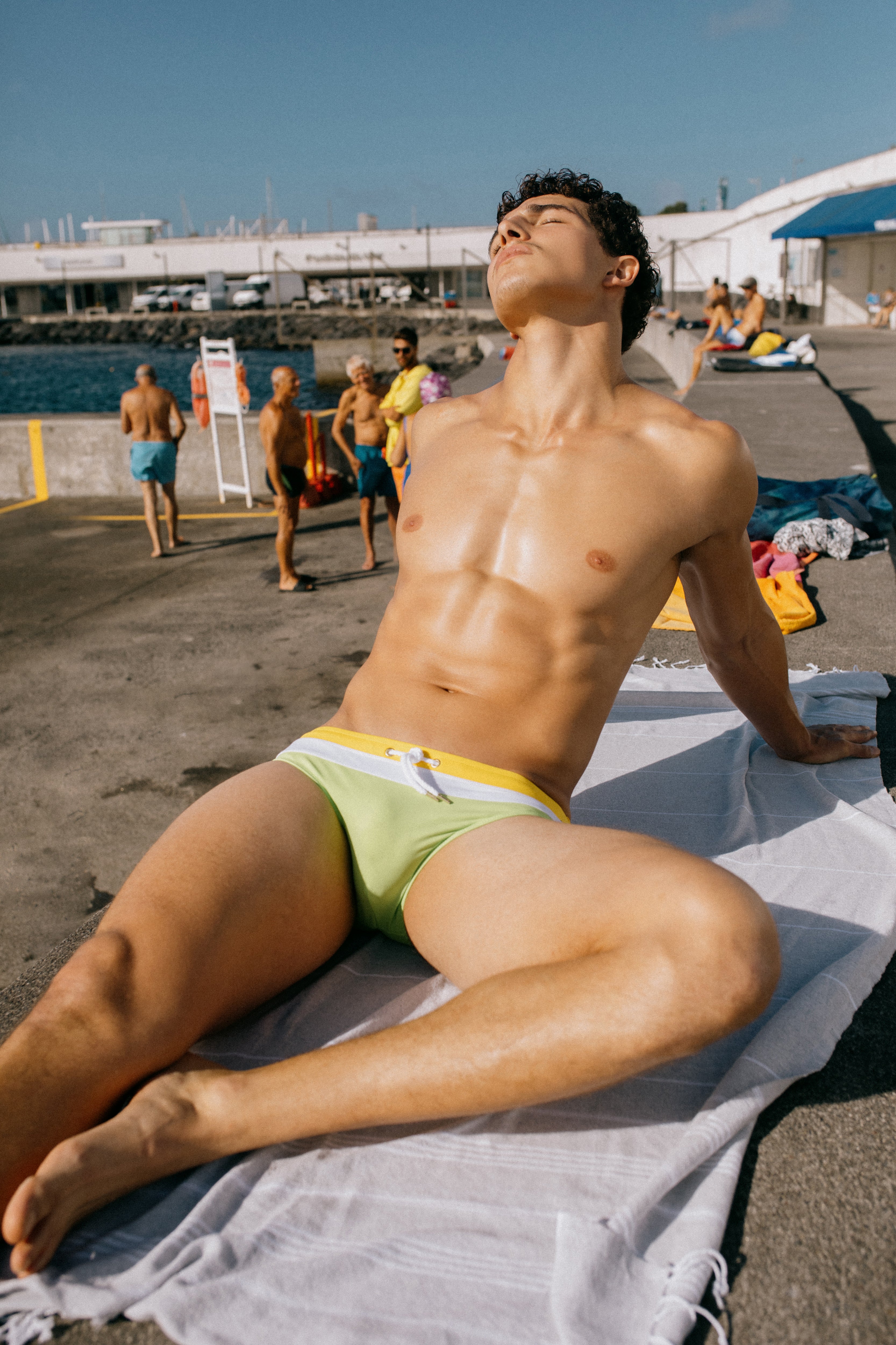 Parke & Ronen Swimwear. Male Model wears Citron color block Meridian swim brief