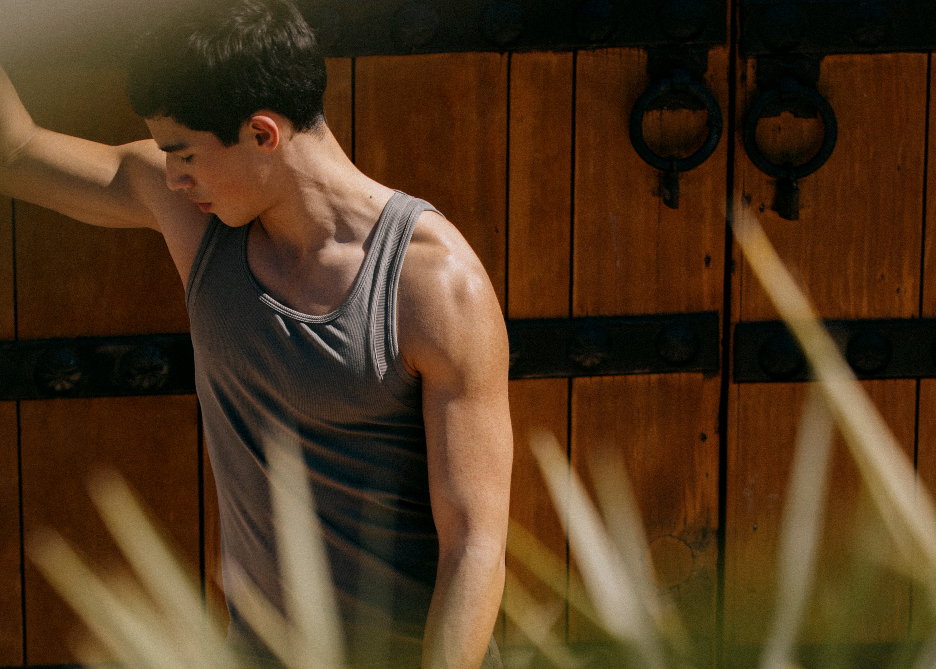 Male model wears Army Green Parke & Ronen ribbed cotton tank top